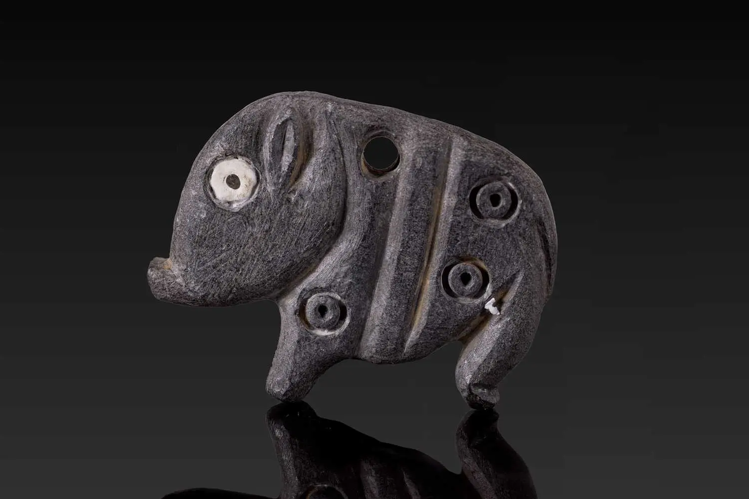 JEMDET NASR STONE AMULET IN THE FORM OF A HOG