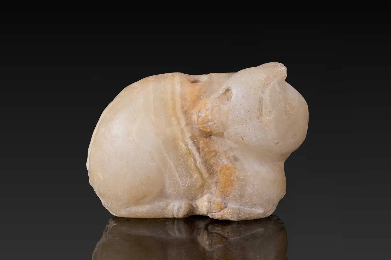 MESOPOTAMIAN STONE AMULET IN THE FORM OF A RECUMBENT BULL