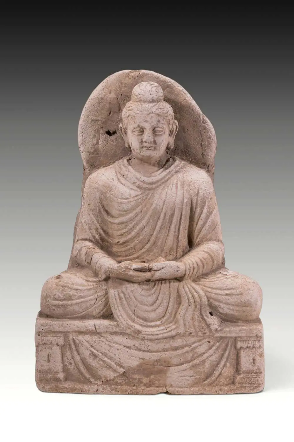 GANDHARA STUCCO FIGURE OF SEATED BUDDHA