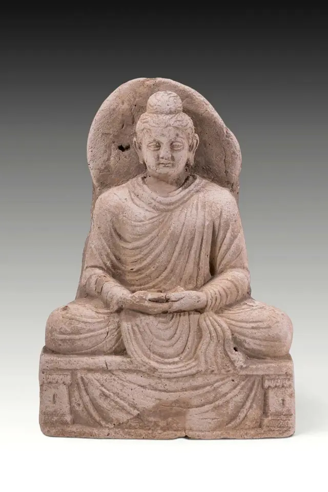 GANDHARA STUCCO FIGURE OF SEATED BUDDHA