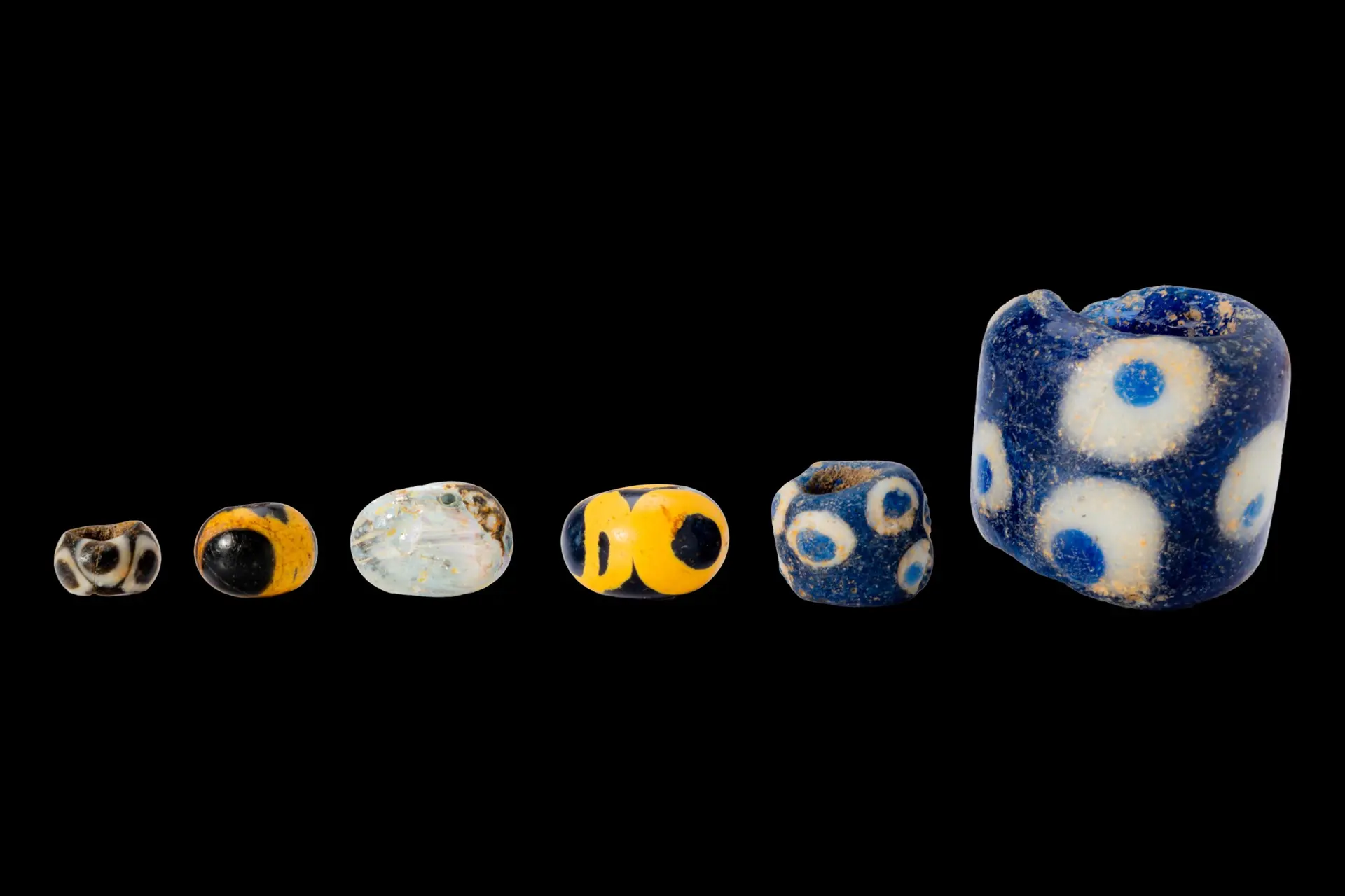 COLLECTION OF PHOENICIAN EYE GLASS BEADS