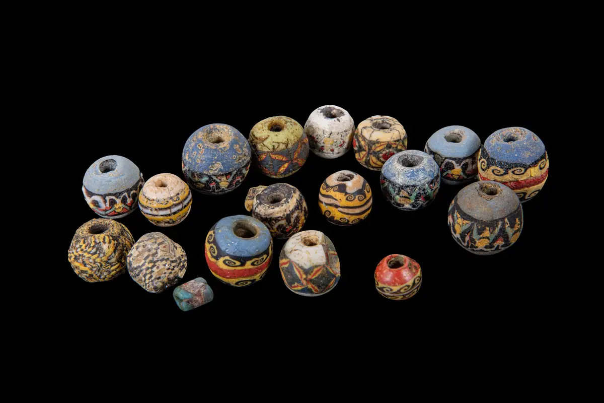 COLLECTION OF ROMAN MOSAIC GLASS BEADS WITH WAVE AND GEOMETRICAL MOTIFS