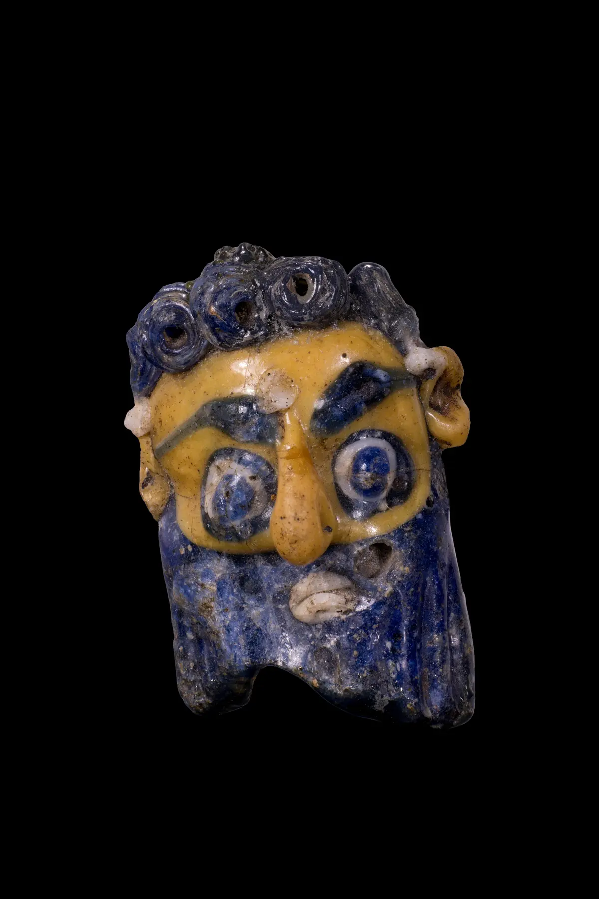 CARTHAGINIAN POLYCHROME GLASS FACE BEAD
