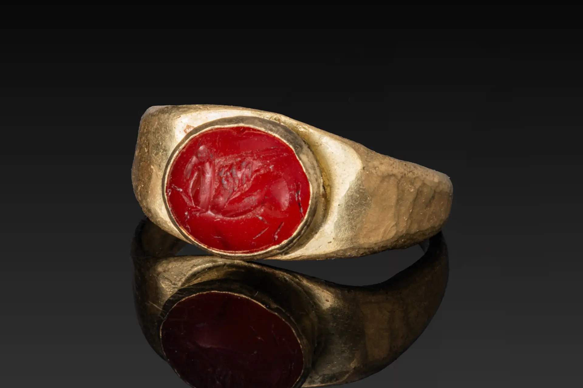 ROMAN CARNELIAN INTAGLIO OF PEGASUS IN HIGH KARAT GOLD RING