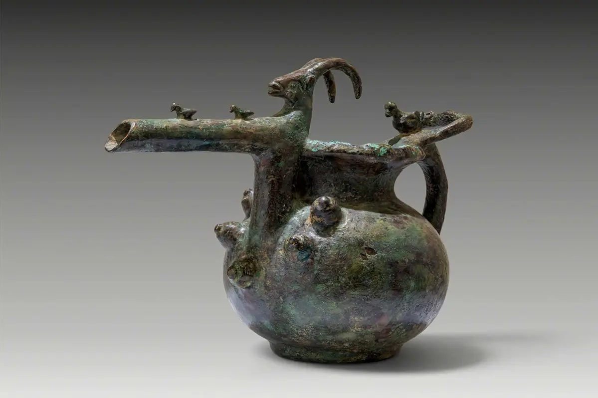 RARE AMLASH BRONZE POURING VESSEL WITH ANIMAL PROTOMES