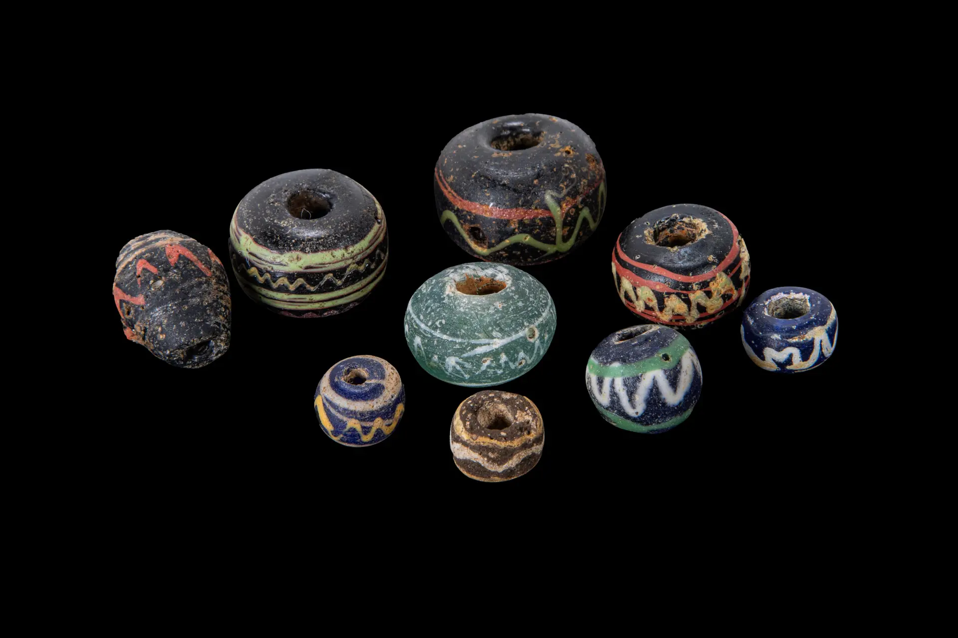 COLLECTION OF GRAECO-ROMAN GLASS BEADS WITH ZIG-ZAG MOTIFS
