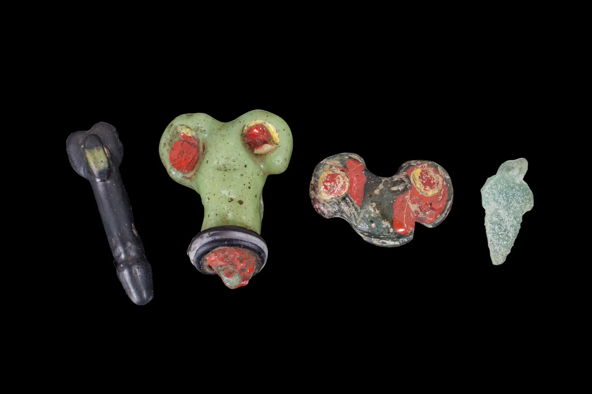 COLLECTION OF GRAECO-ROMAN GLASS PHALLUS-SHAPED AMULETS