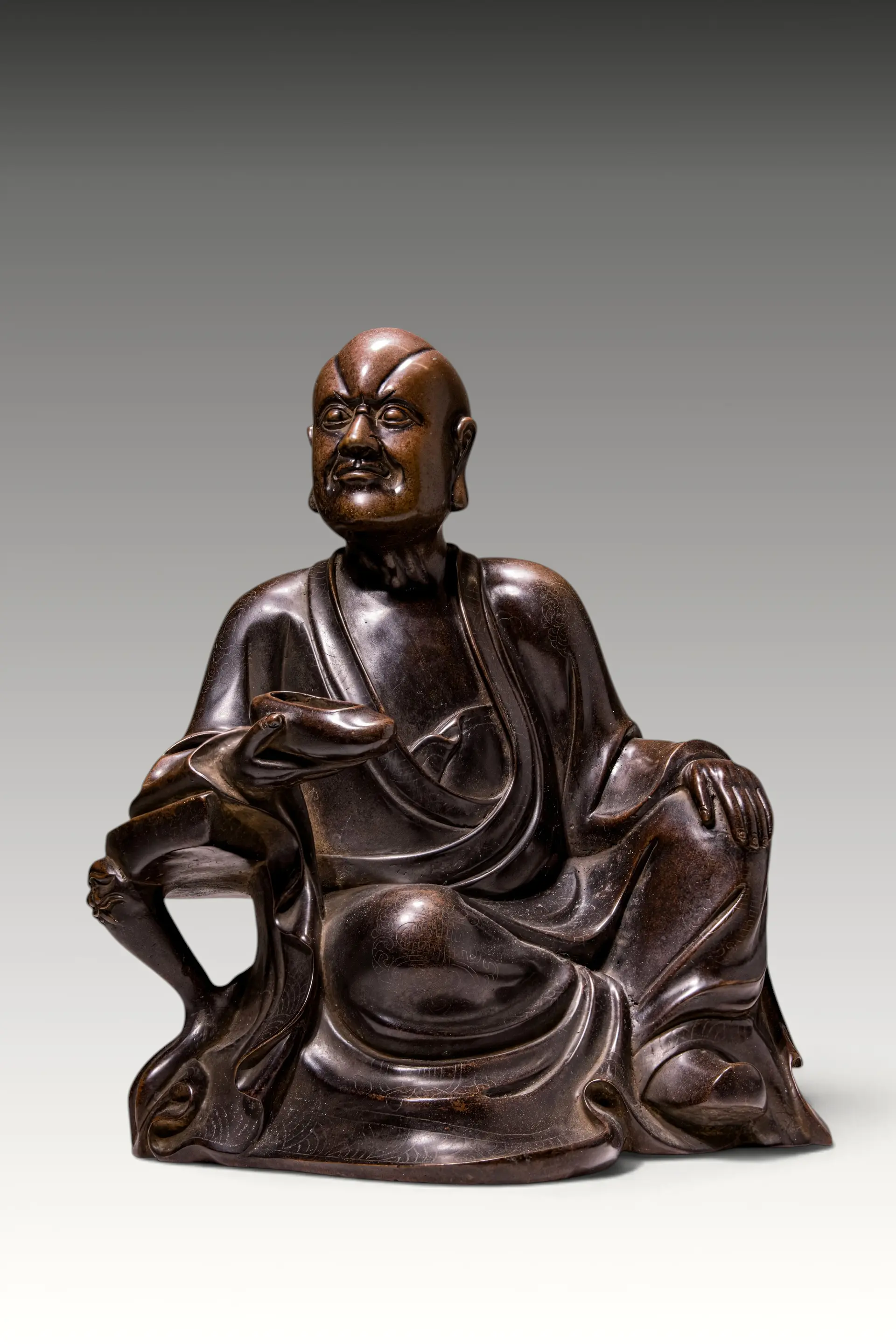 CHINESE SILVER-INLAID BRONZE FIGURE OF A LUOHAN