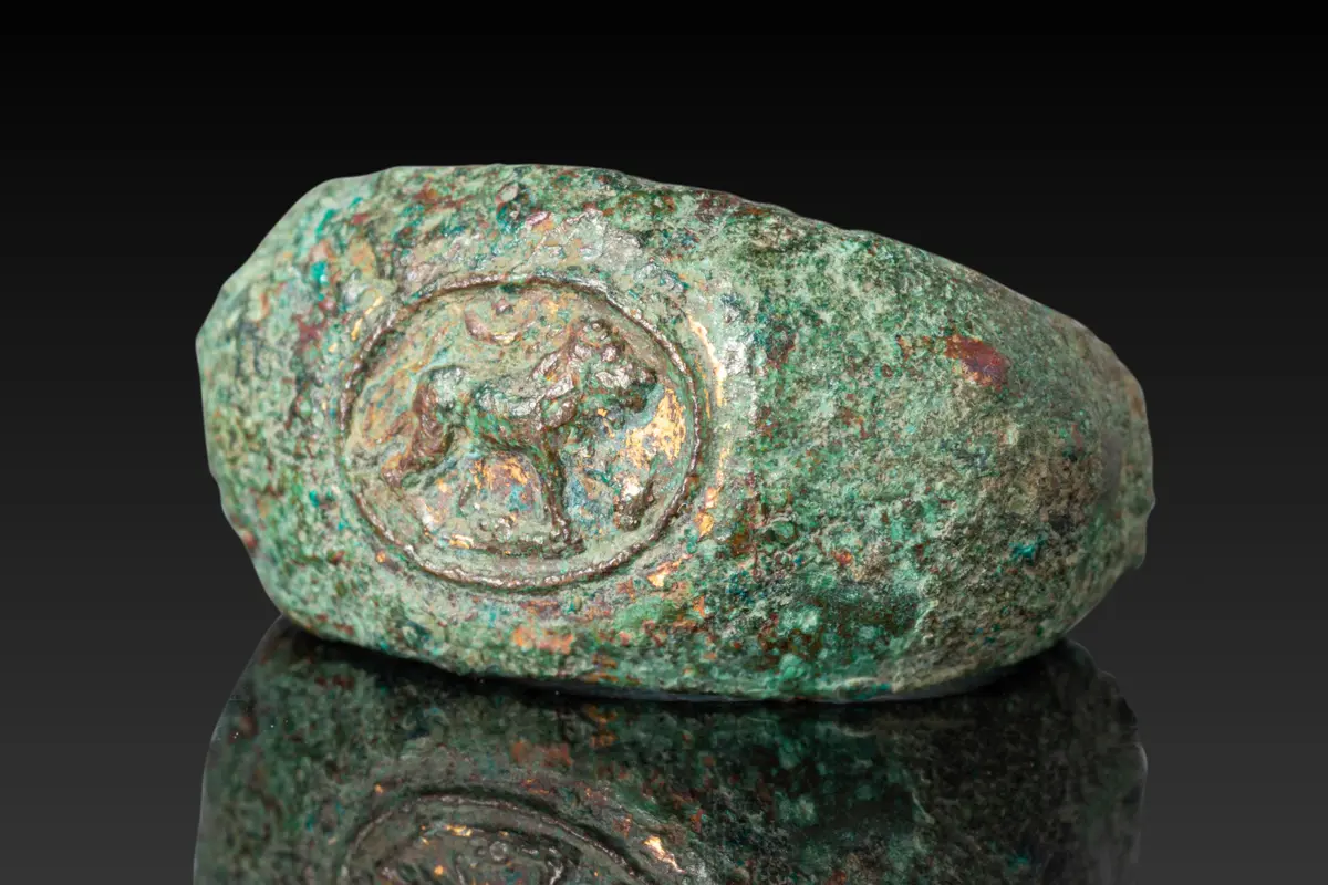 GRAECO-ROMAN BRONZE RING WITH LION, CRESCENT AND STAR