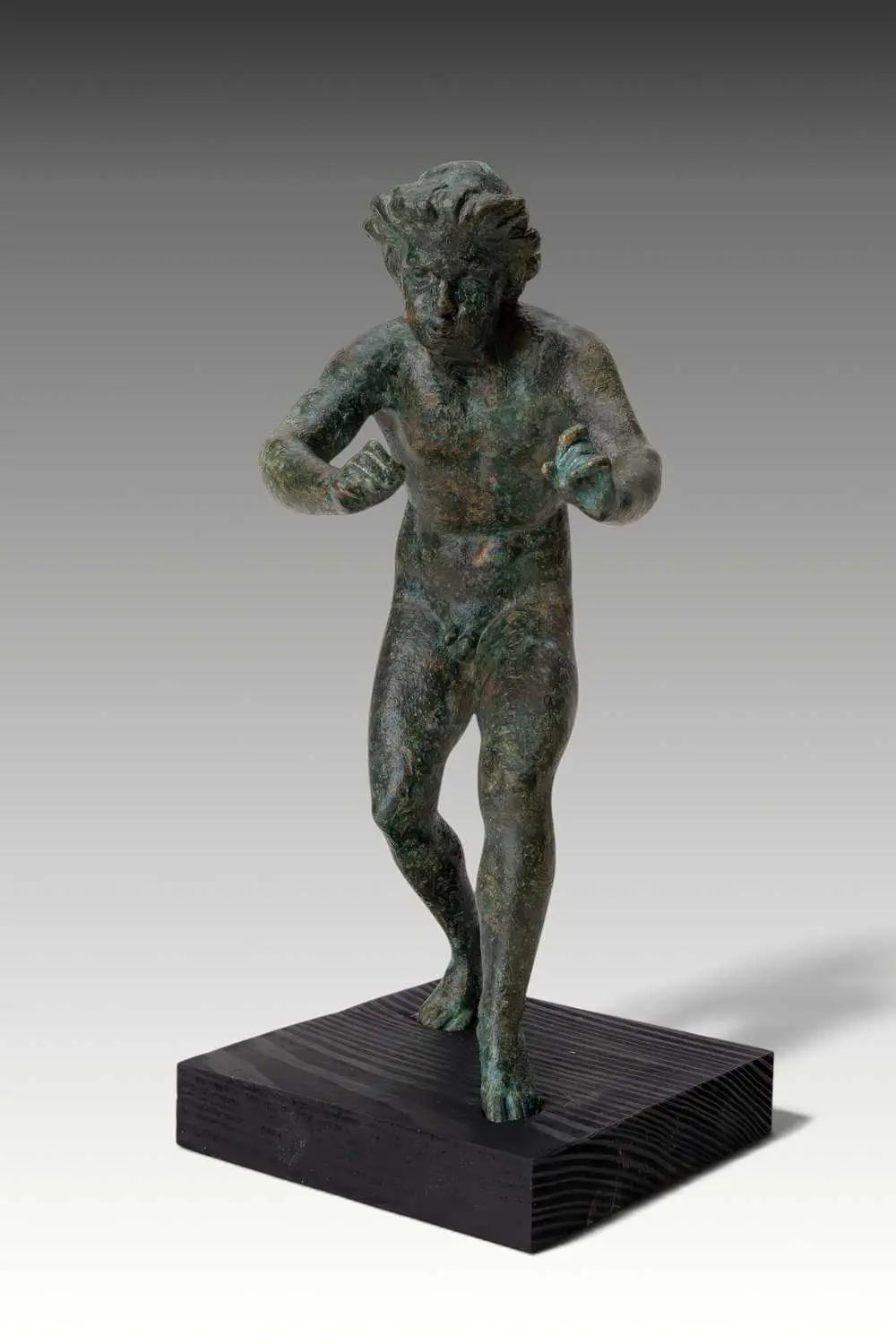 RARE ROMAN BRONZE FIGURINE OF A MUSICIAN PLAYING A FLUTE