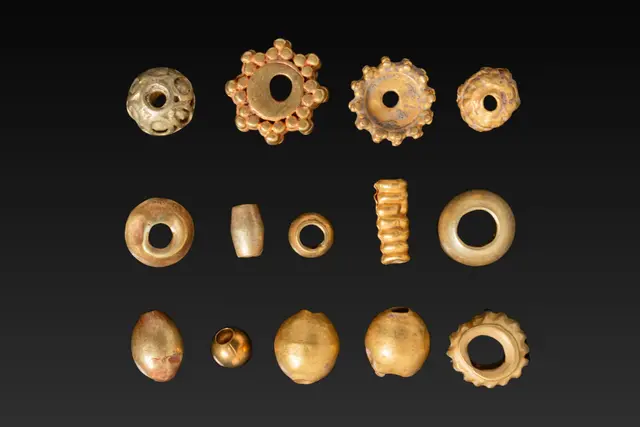 LARGE COLLECTION OF GREEK HIGH KARAT GOLD BEADS