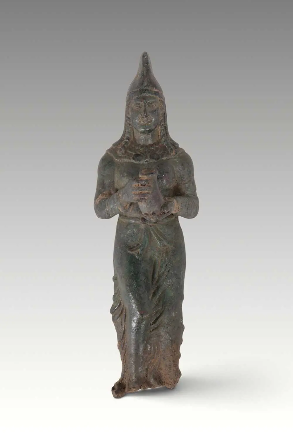 EASTERN MEDITERRANEAN BRONZE FIGURE OF A FEMALE OFFERER