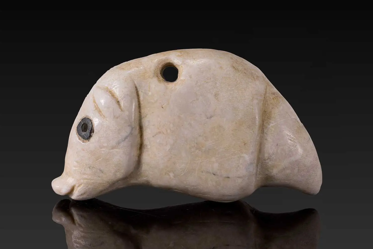 JEMDET NASR STONE AMULET IN THE FORM OF A HOG