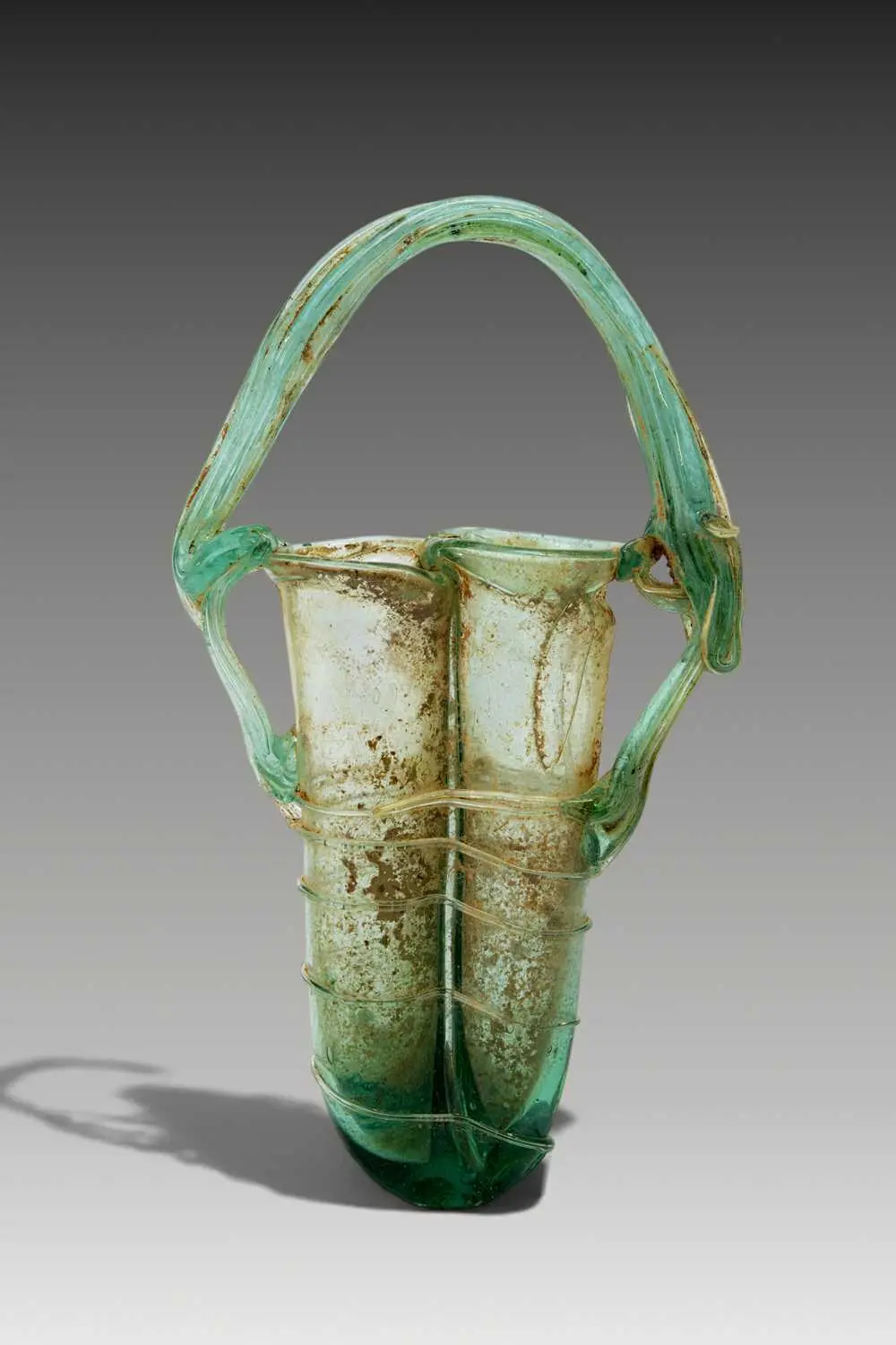 ROMAN GLASS DOUBLE UNGUENTARIUM WITH GLASS THREAD DECORATION