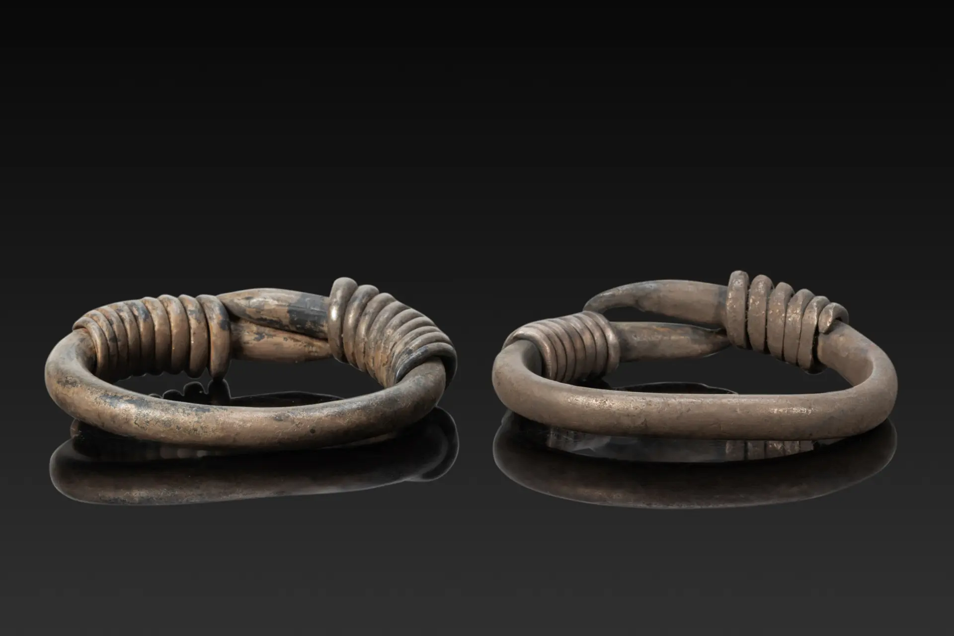 MATCHED PAIR OF ROMANO-EGYPTIAN SILVER BRACELETS