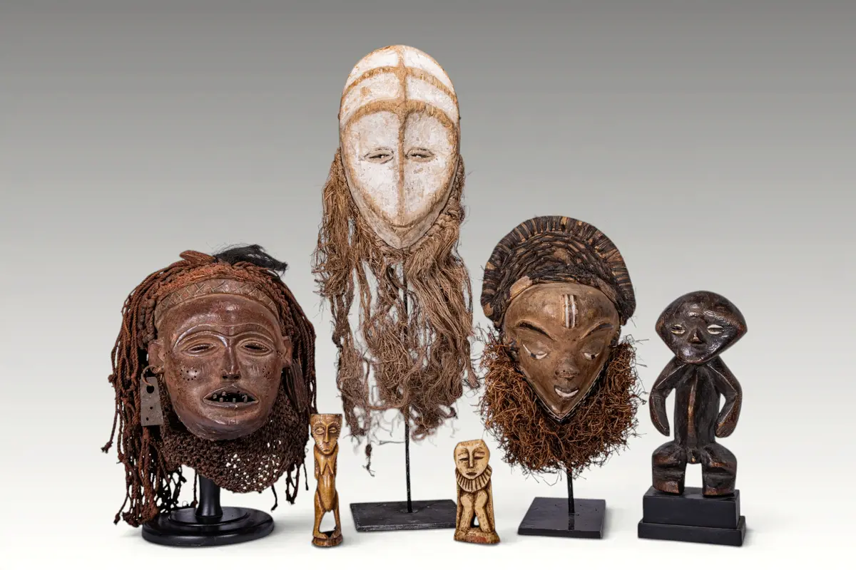 GROUP OF AFRICAN MASKS AND FIGURES