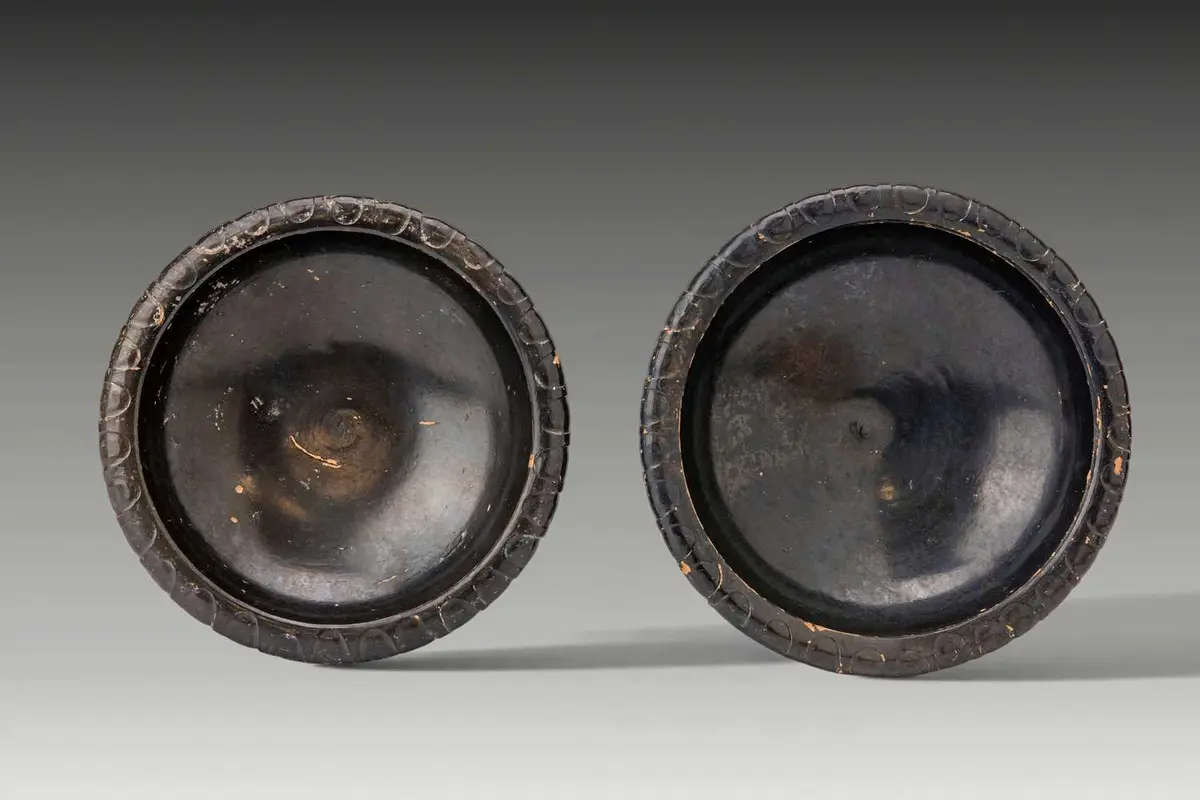 PAIR OF GREEK BLACK-GLAZED SHALLOW BOWLS