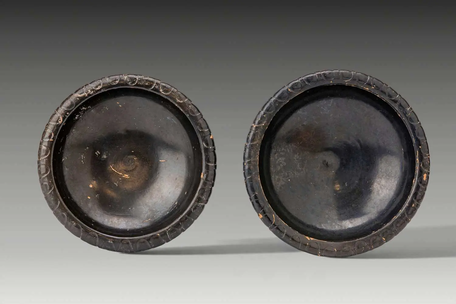 PAIR OF GREEK BLACK-GLAZED SHALLOW BOWLS