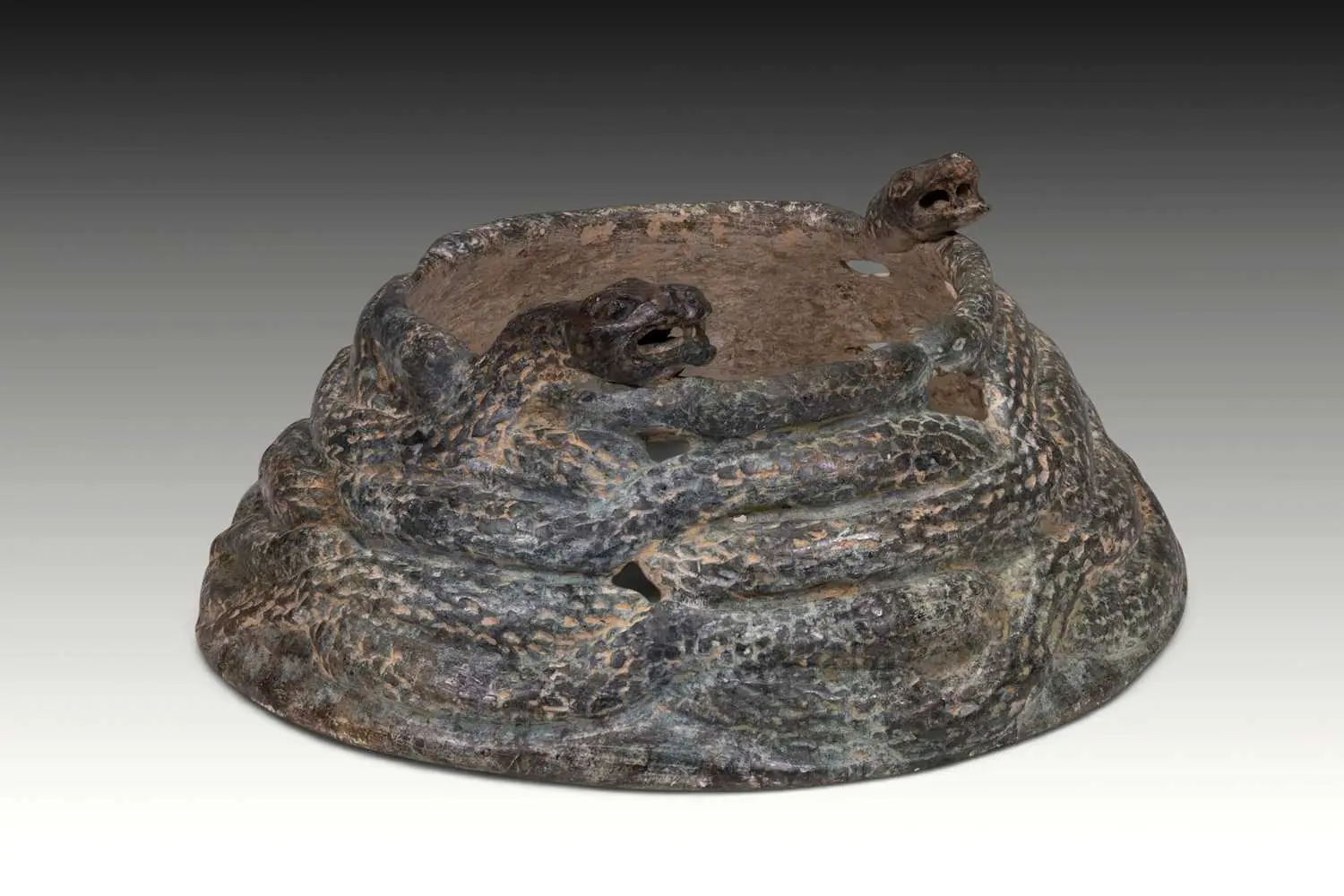 RARE BACTRIAN SCHIST FITTING WITH COILED SNAKES