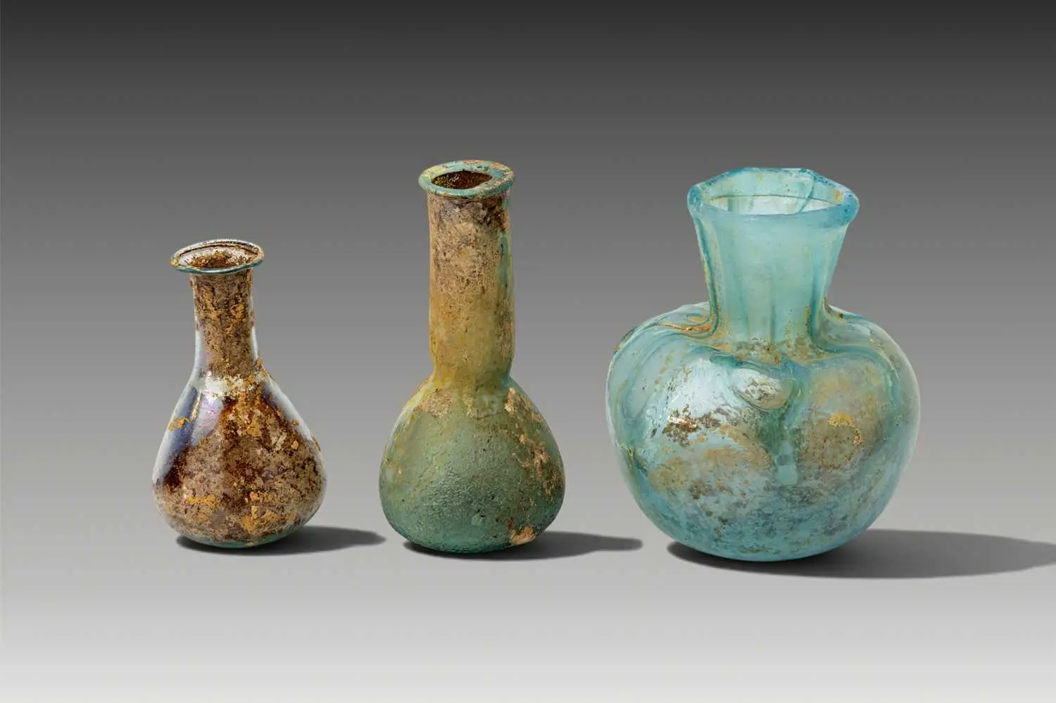 COLLECTION OF ROMAN GLASS UNGUENTARIA