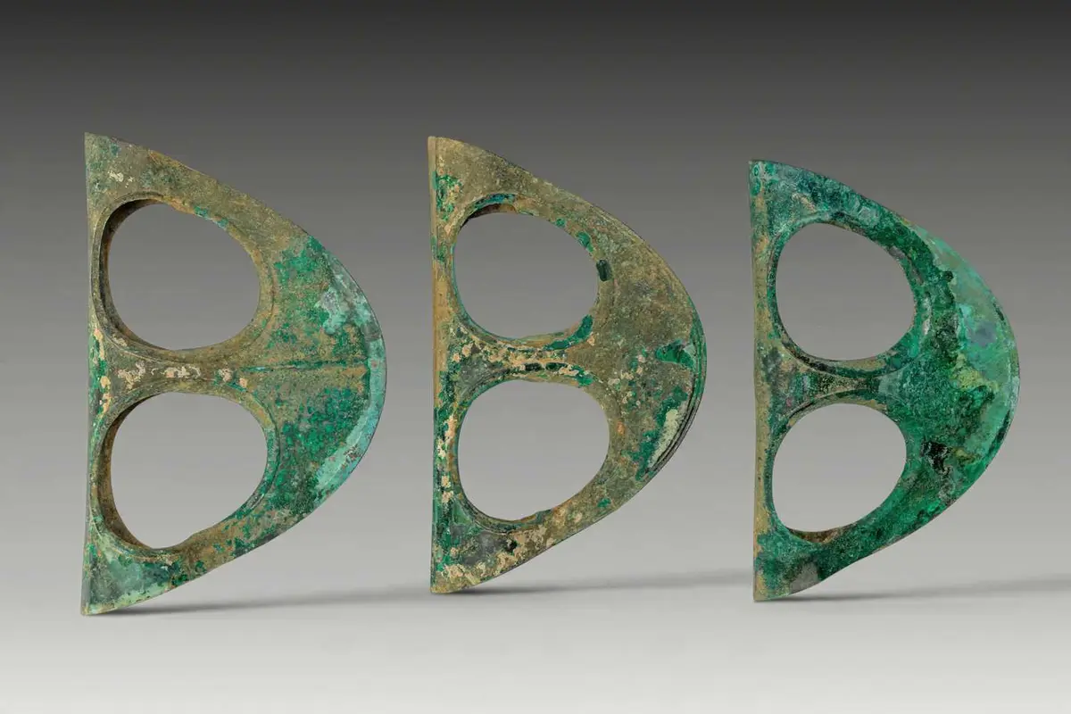 COLLECTION OF EGYPTIAN BRONZE FENESTRATED AXE HEADS