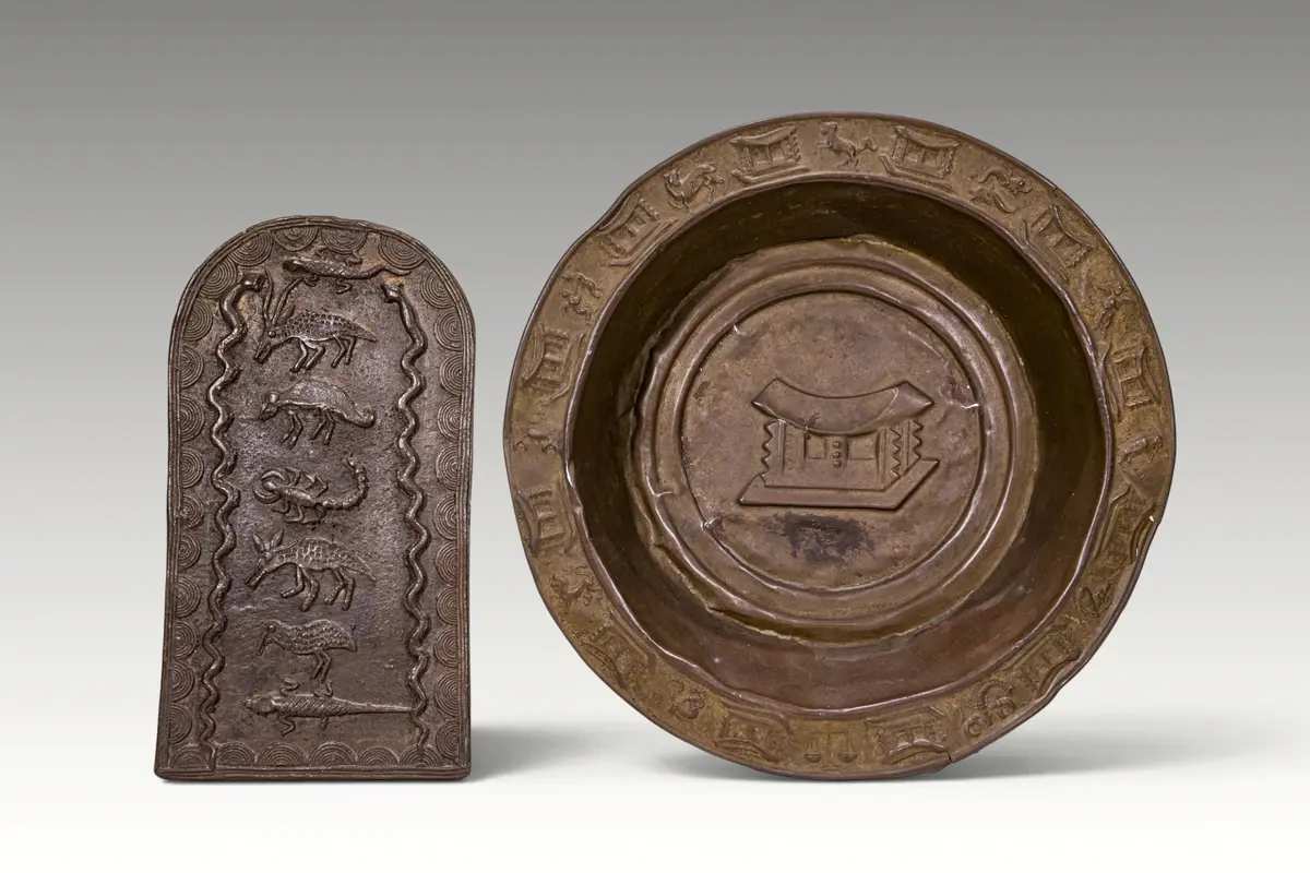 AKAN BRONZE ZODIAC PLATE AND ZOOMORPHIC PLAQUE