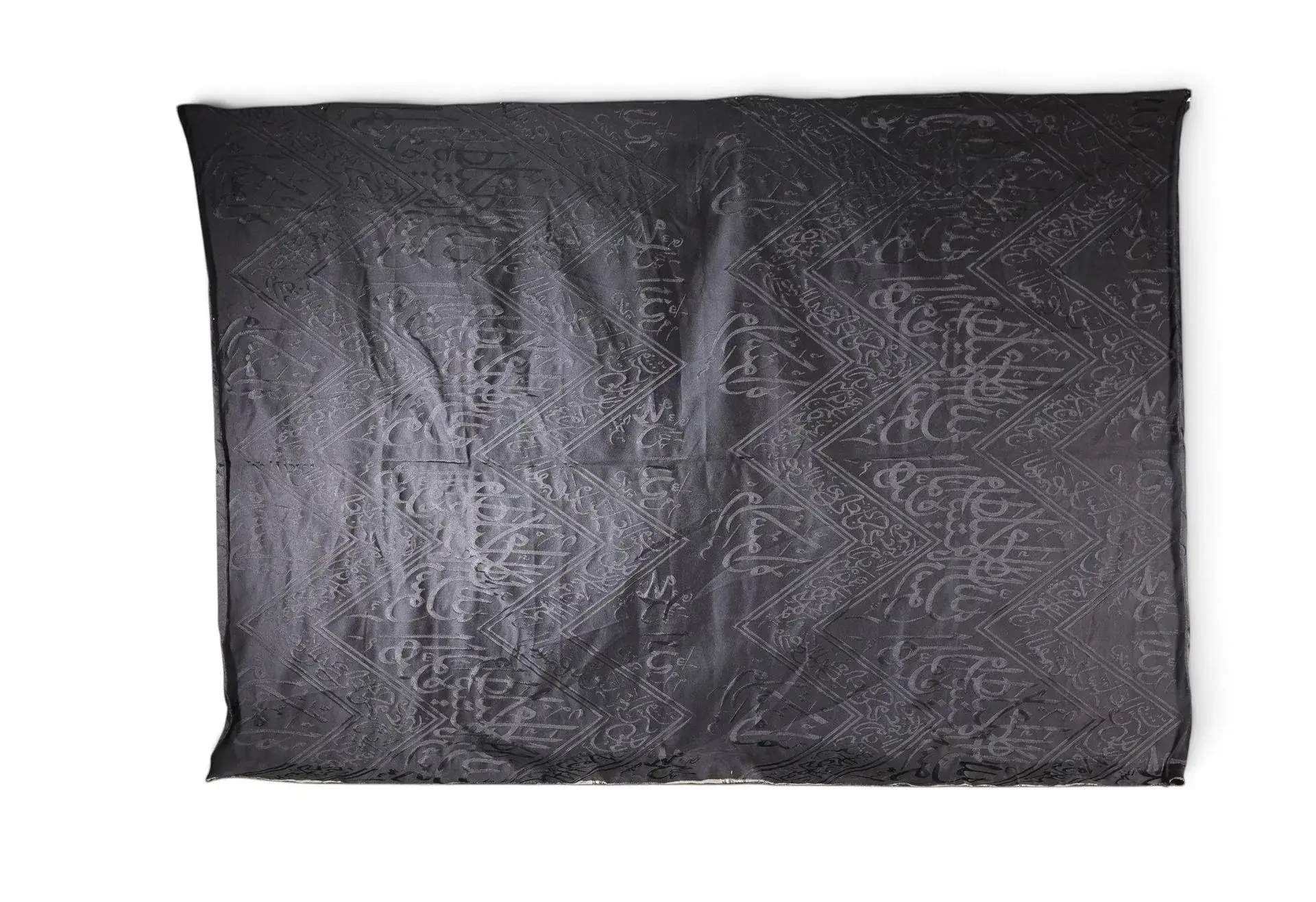FRAGMENT OF BLACK KISWAH FABRIC FROM THE KA‘BA, SAUDI ARABIA - Lot 119