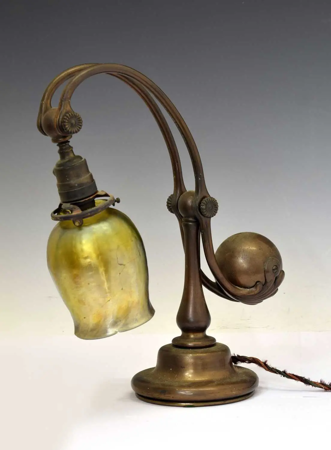 Tiffany Studios, a counter-balance patinated bronze desk lamp with