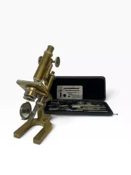 A 19th century lacquered brass microscope, stamped on the base '67
