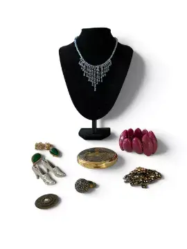 A collection of costume jewellery including: a burgundy plastic bracelet