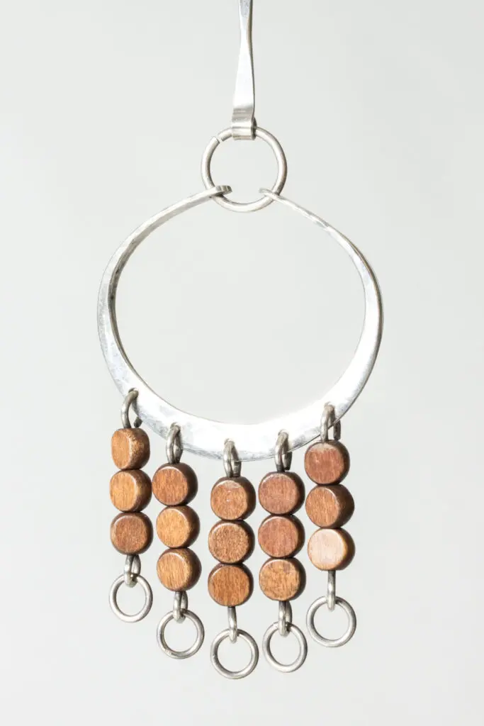 Silver and wood pendant by Anna Greta Eker