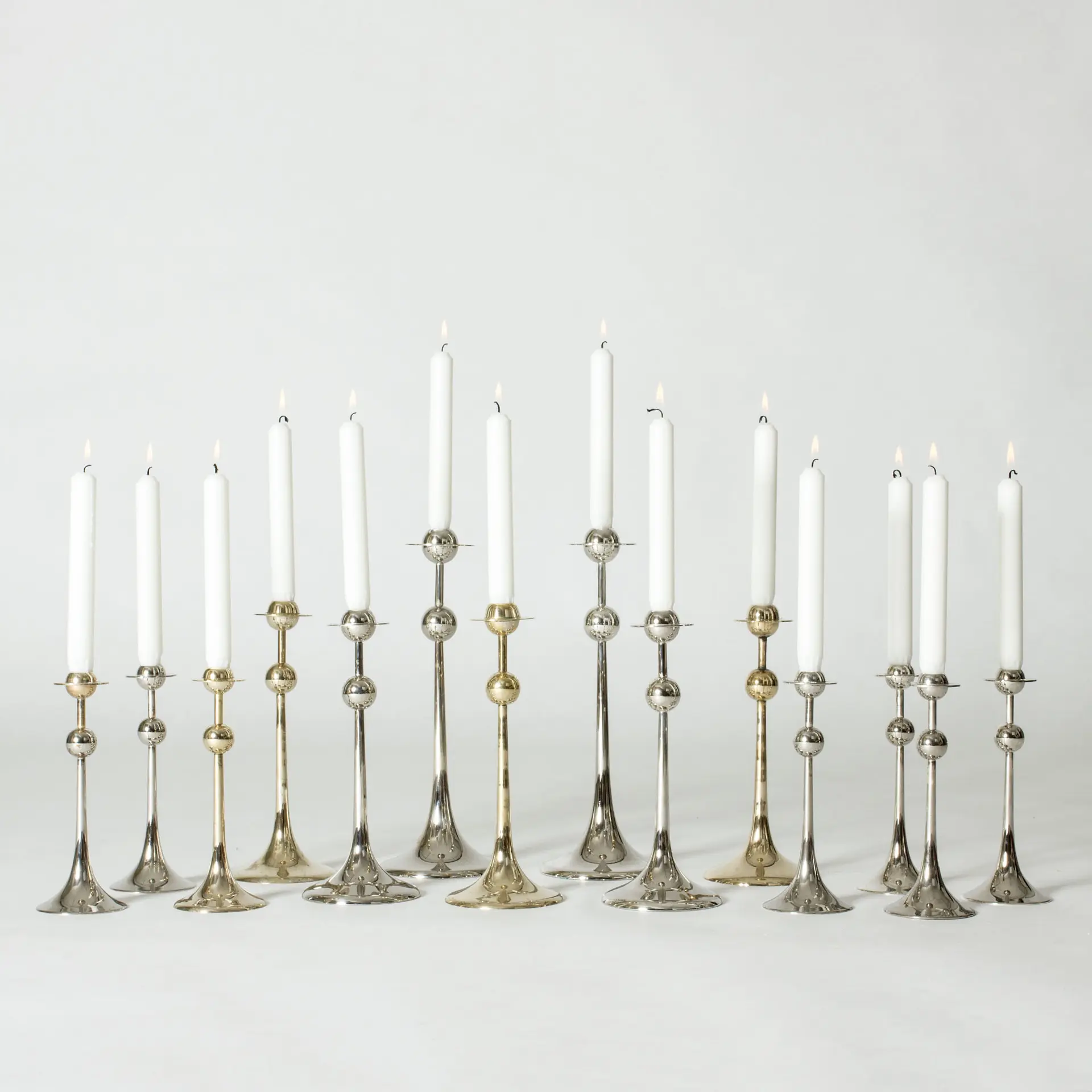 Set of 14 “Saturnus” candlesticks by Kjell Engman