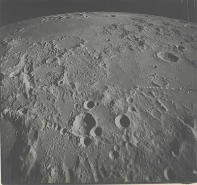 APOLLO 16 - The Moon Unfolding to the Horizon: View Toward Hipparchus Crater