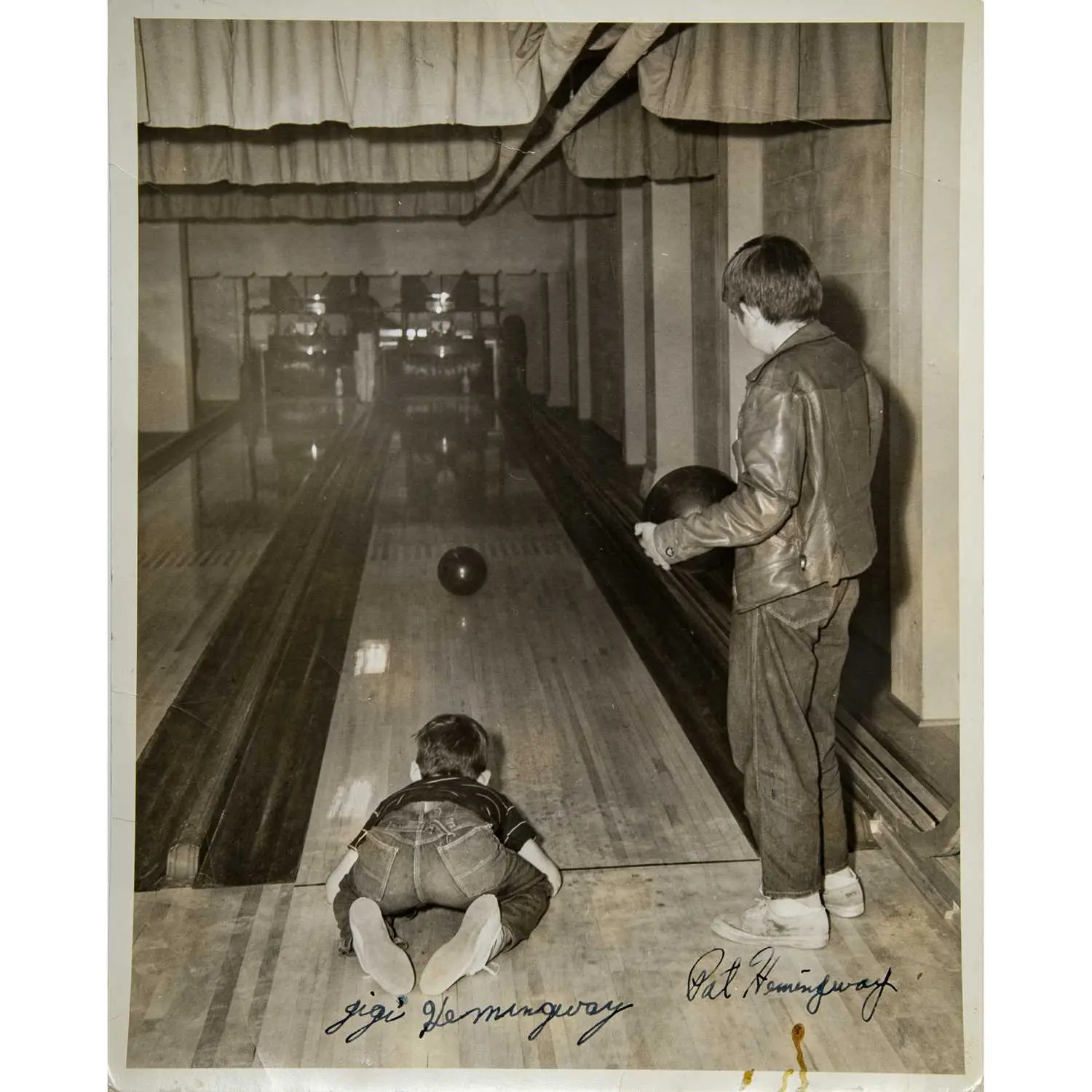 A photograph of Ernest Hemingway's children, with signatures