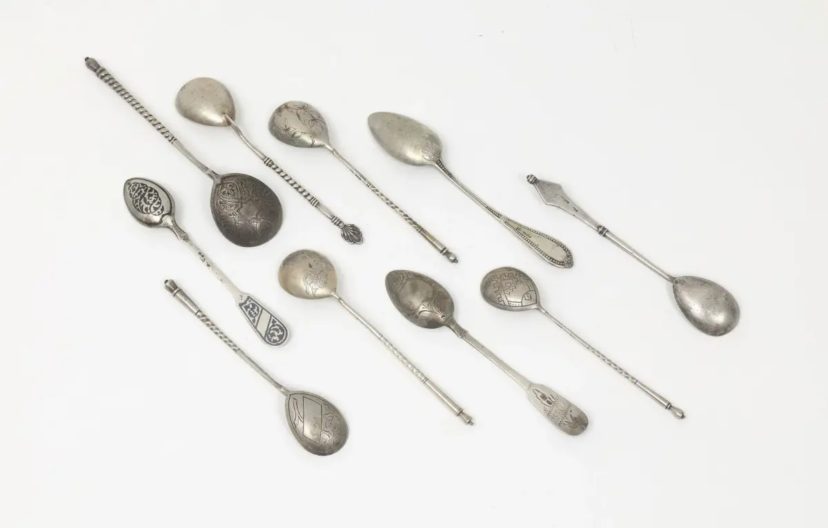 SIX TEA SPOONS by K. FABERGE Various designs. We are including three