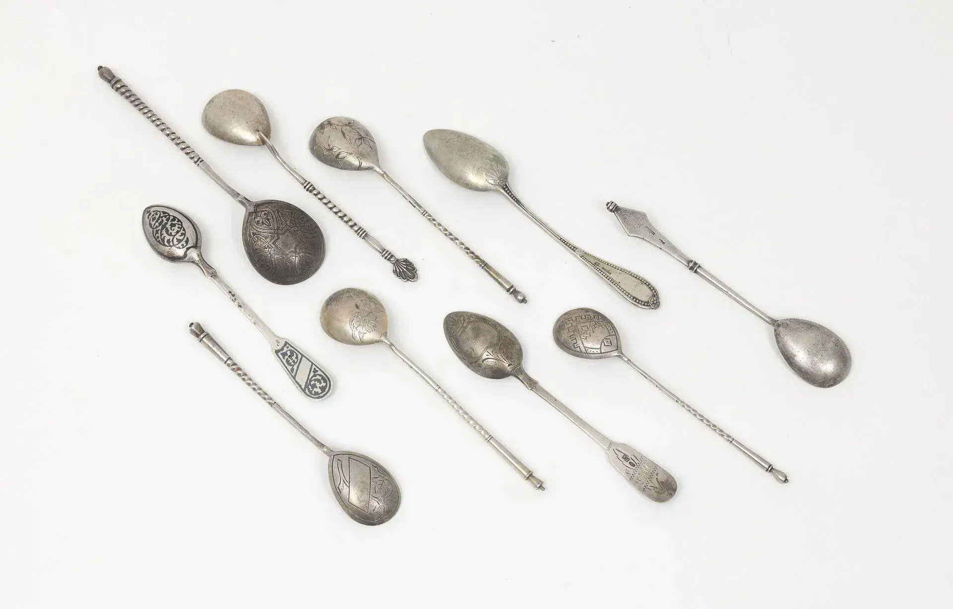 SIX TEA SPOONS by K. FABERGE Various designs. We are including three