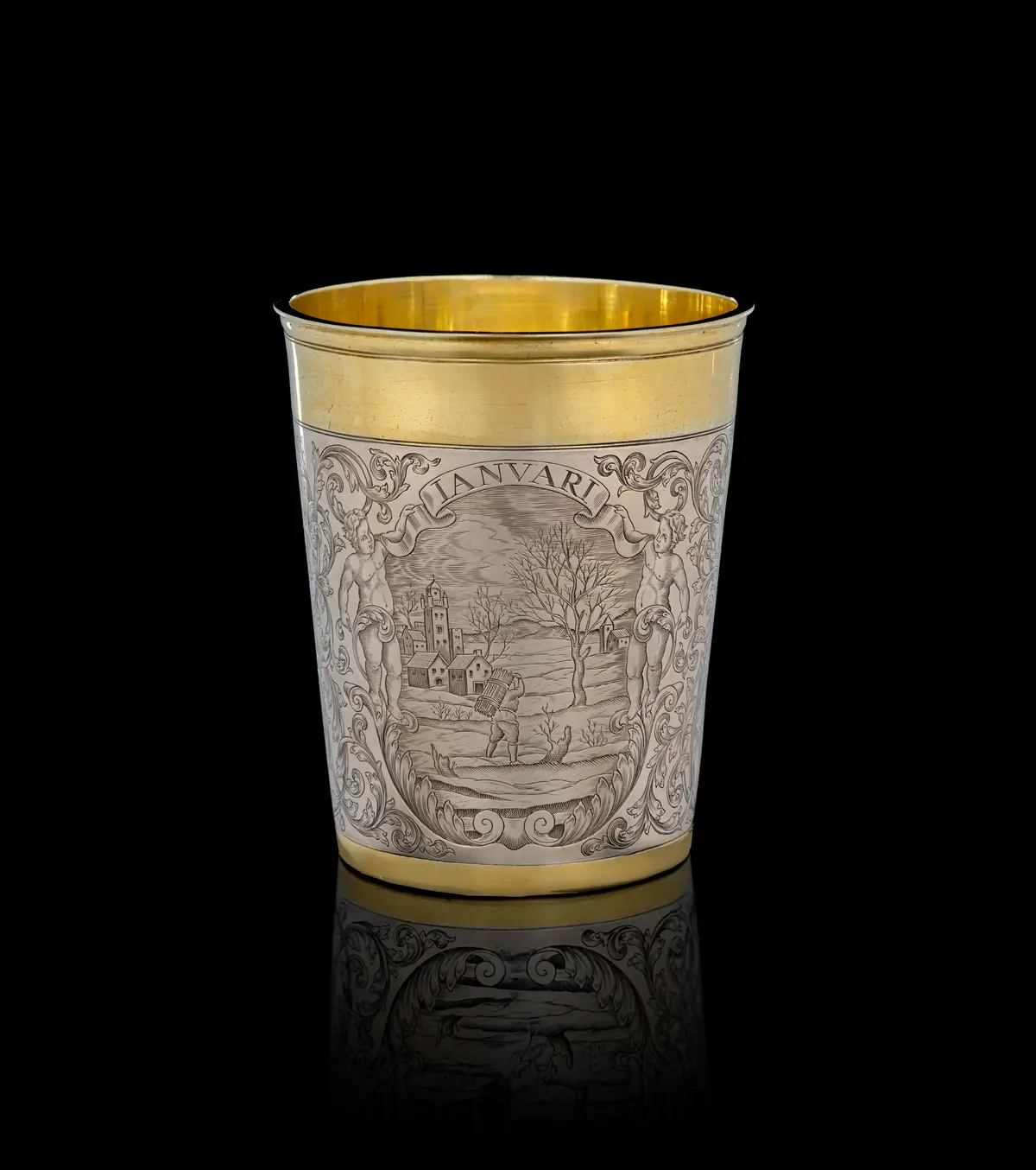 A German parcel-gilt silver "January" beaker, Simon Wickert, Augsburg
