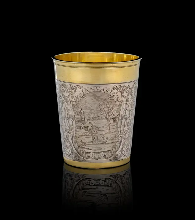 A German parcel-gilt silver "January" beaker, Simon Wickert, Augsburg