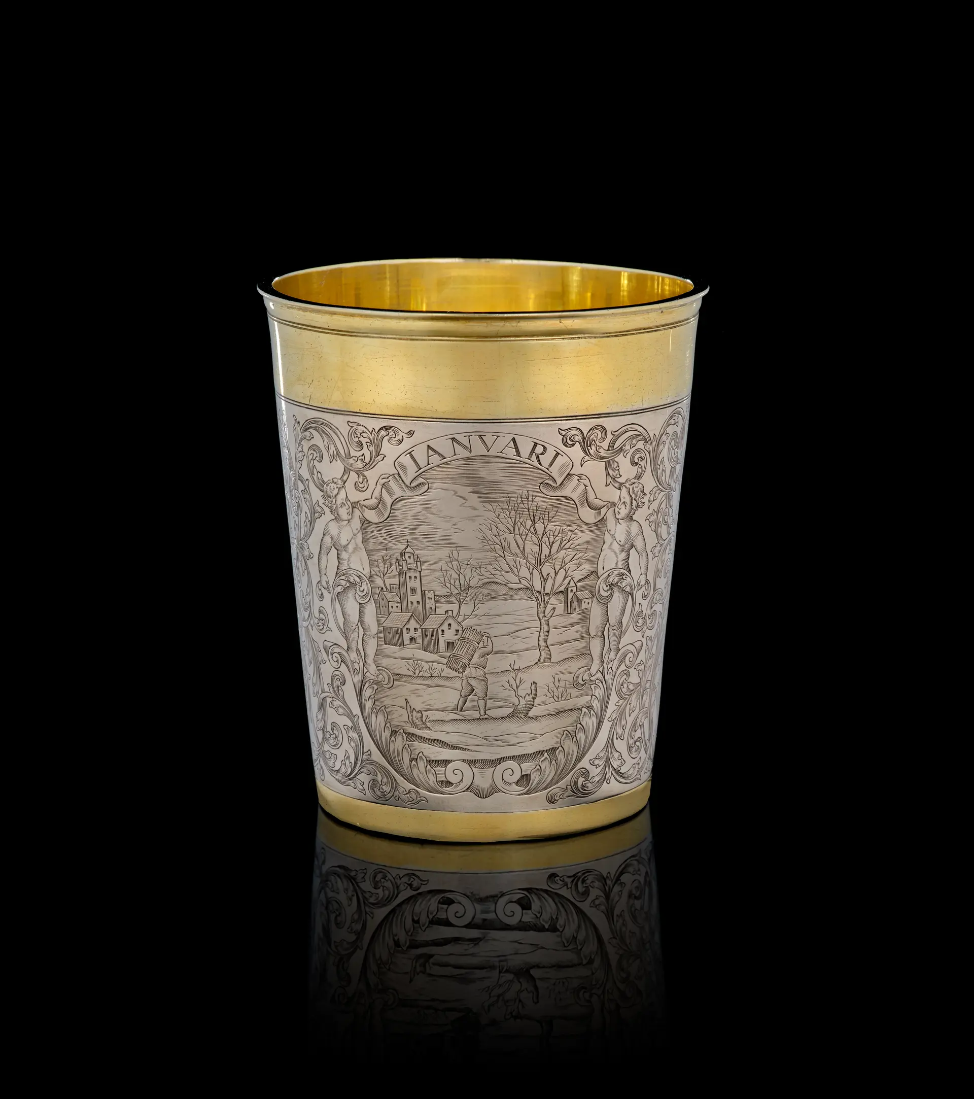 A German parcel-gilt silver "January" beaker, Simon Wickert, Augsburg