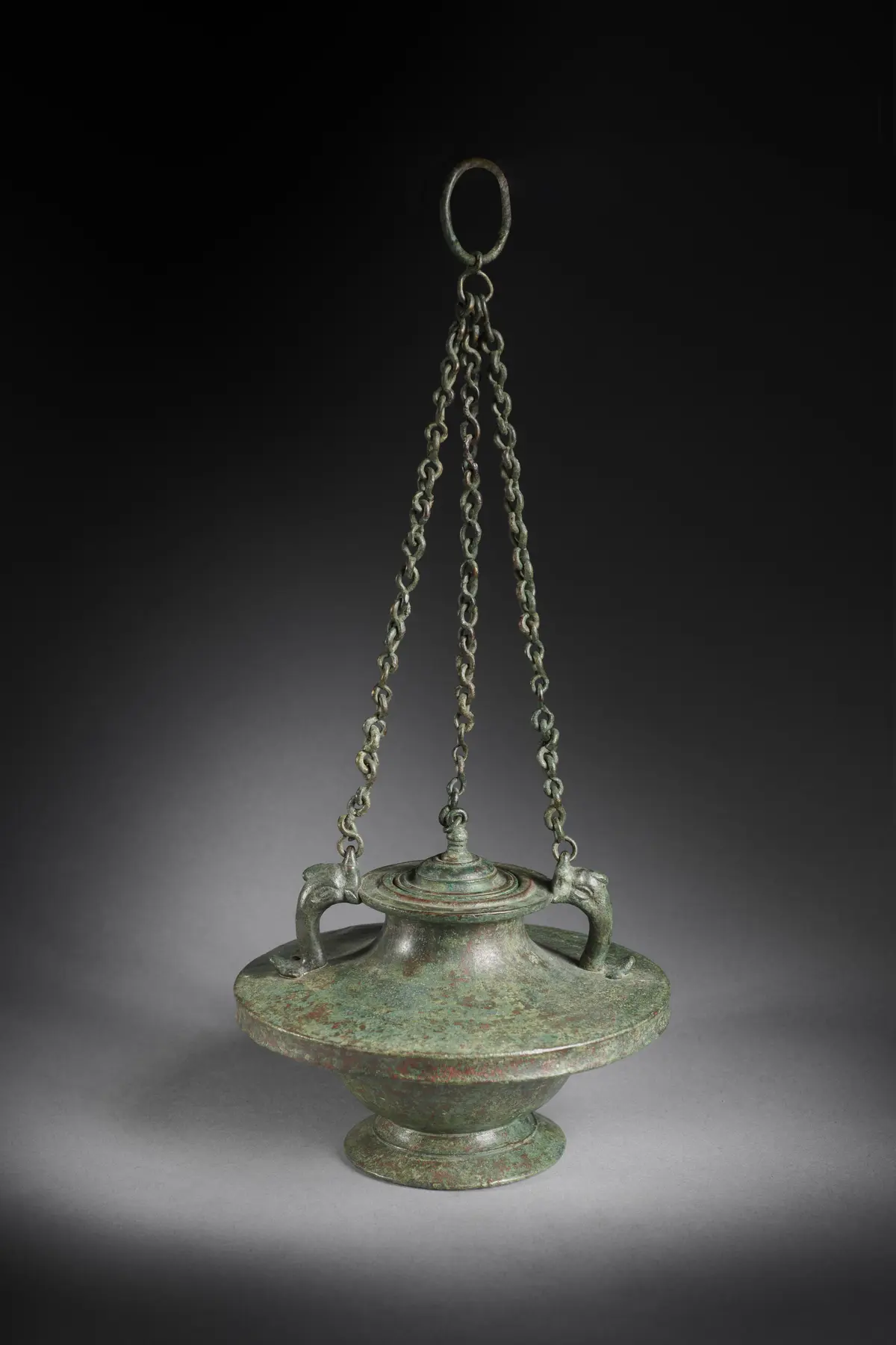 A Roman bronze hanging lidded pyxis