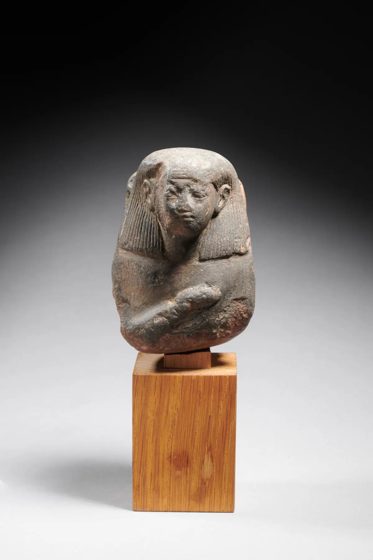 An Egyptian quartzite bust of a man