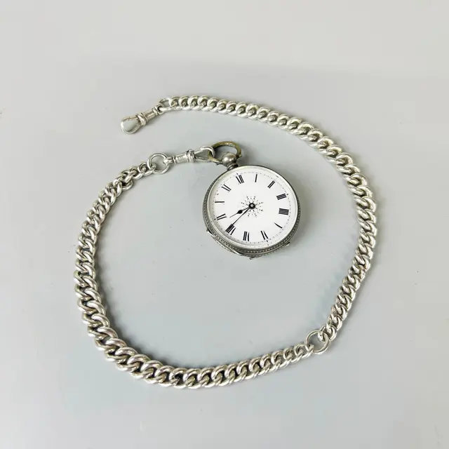 SILVER POCKET WATCH AND CHAIN.