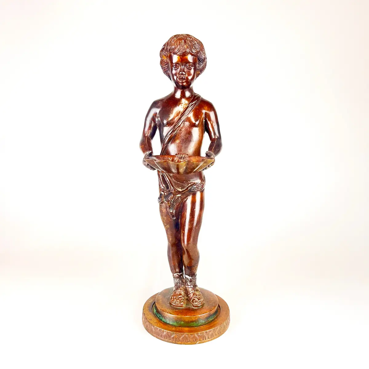 BRONZE FIGURE OF BOY.