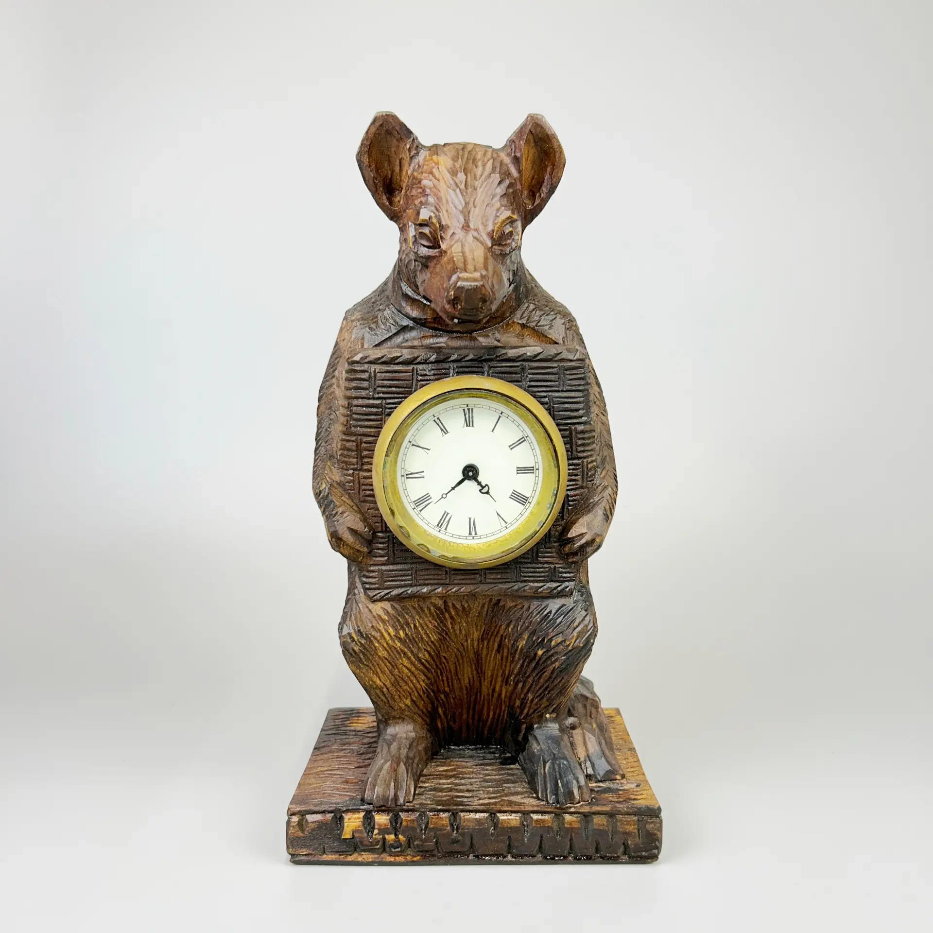 A BLACK FOREST STYLE CLOCK.