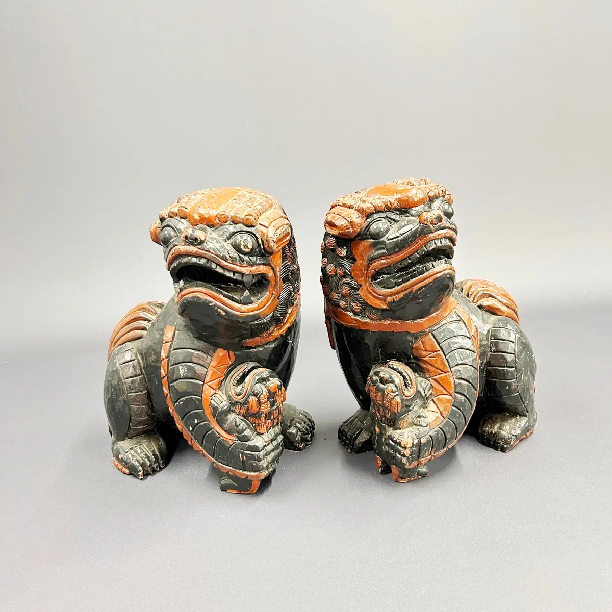 LARGE WOODEN LION DOGS.