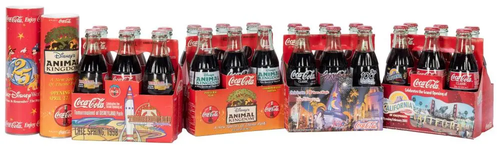 Lot of Disney Commemorative Coke Bottles. Four six packs of...