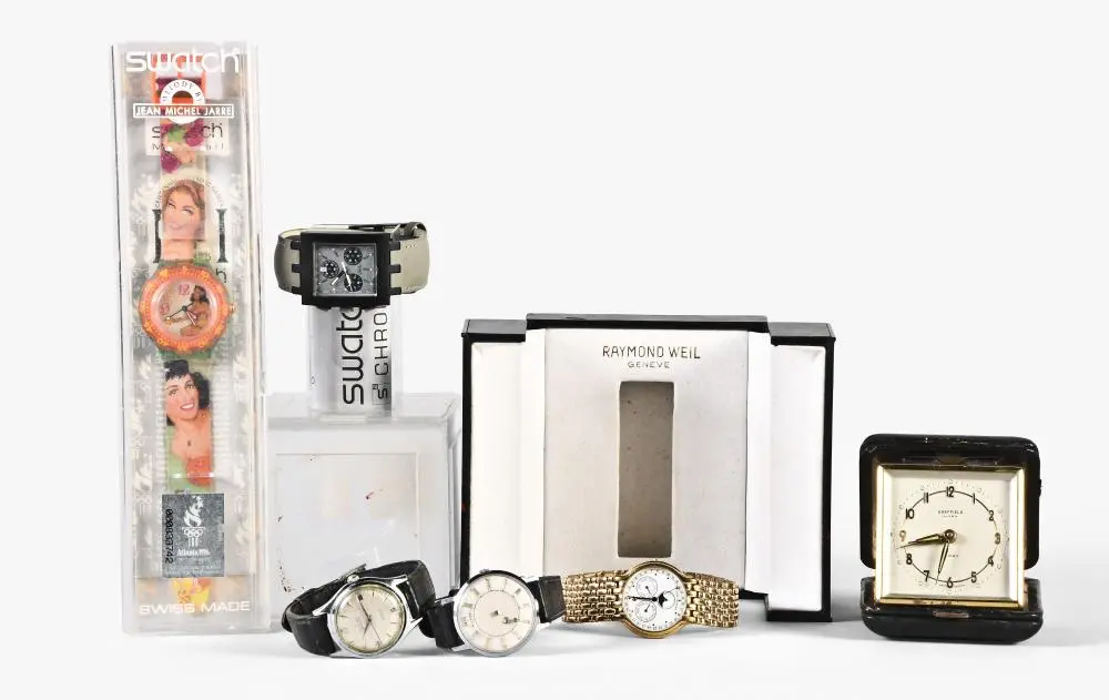 A lot of five wrist watches and a travel clock