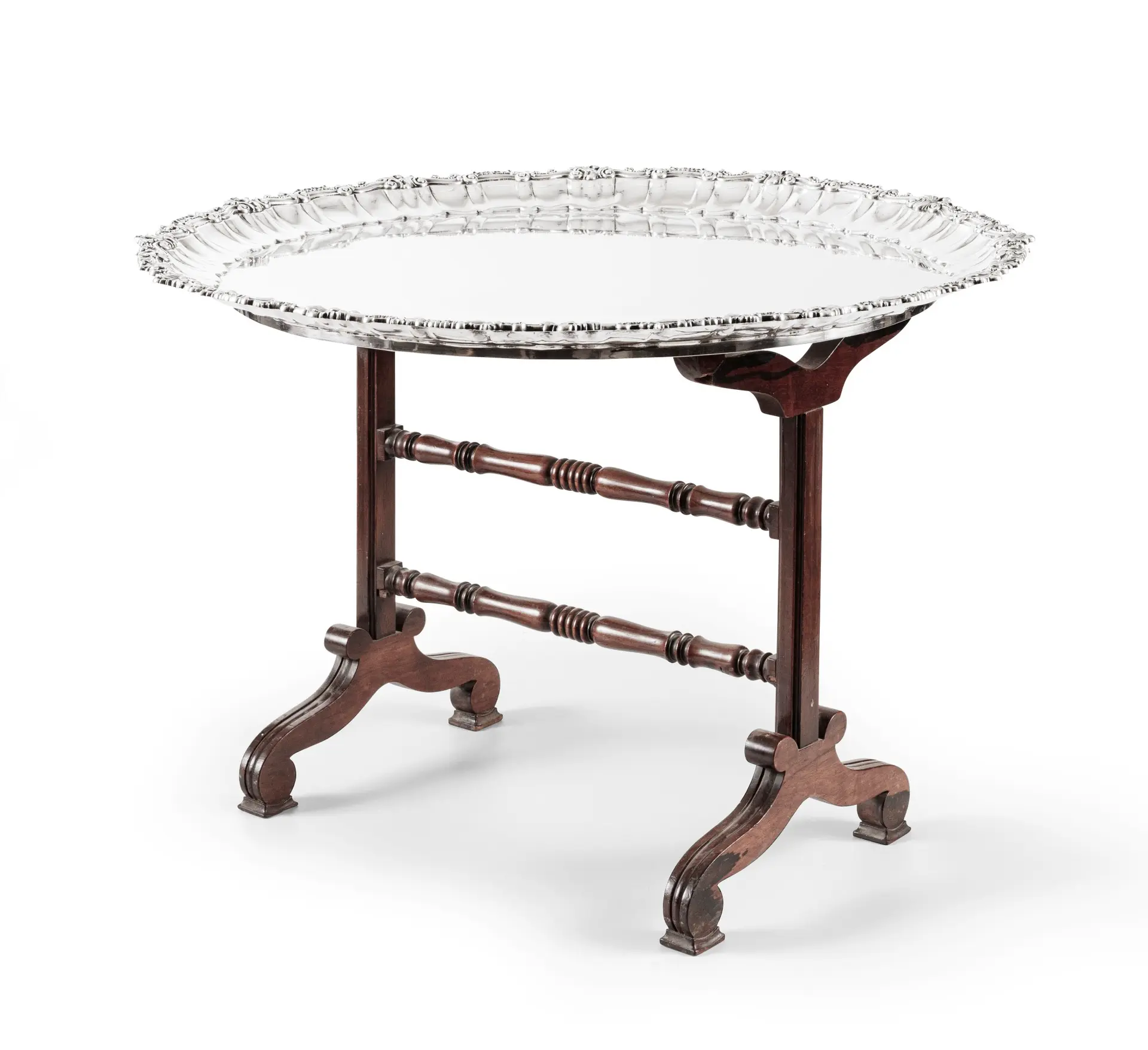 A large Italian silver tray with wood support forming coffee-table