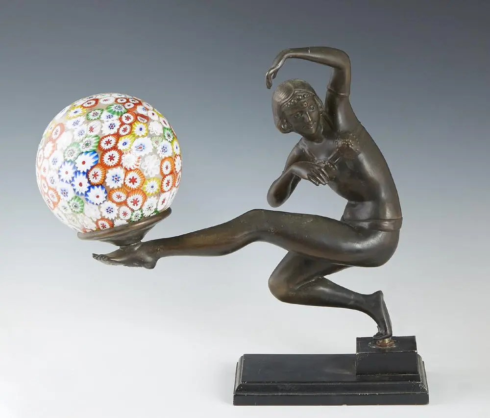 Art Deco Patinated Spelter Figural Lamp, 20th c., in the manner of Gerda Gerdago (1906-2004), of a dancer balancing a millefiore bal...
