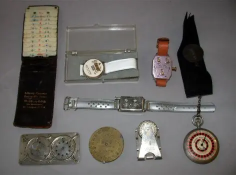 A Dormie ""watch"" golf scorer; a ""handy"" brass dial golf scorer; an M